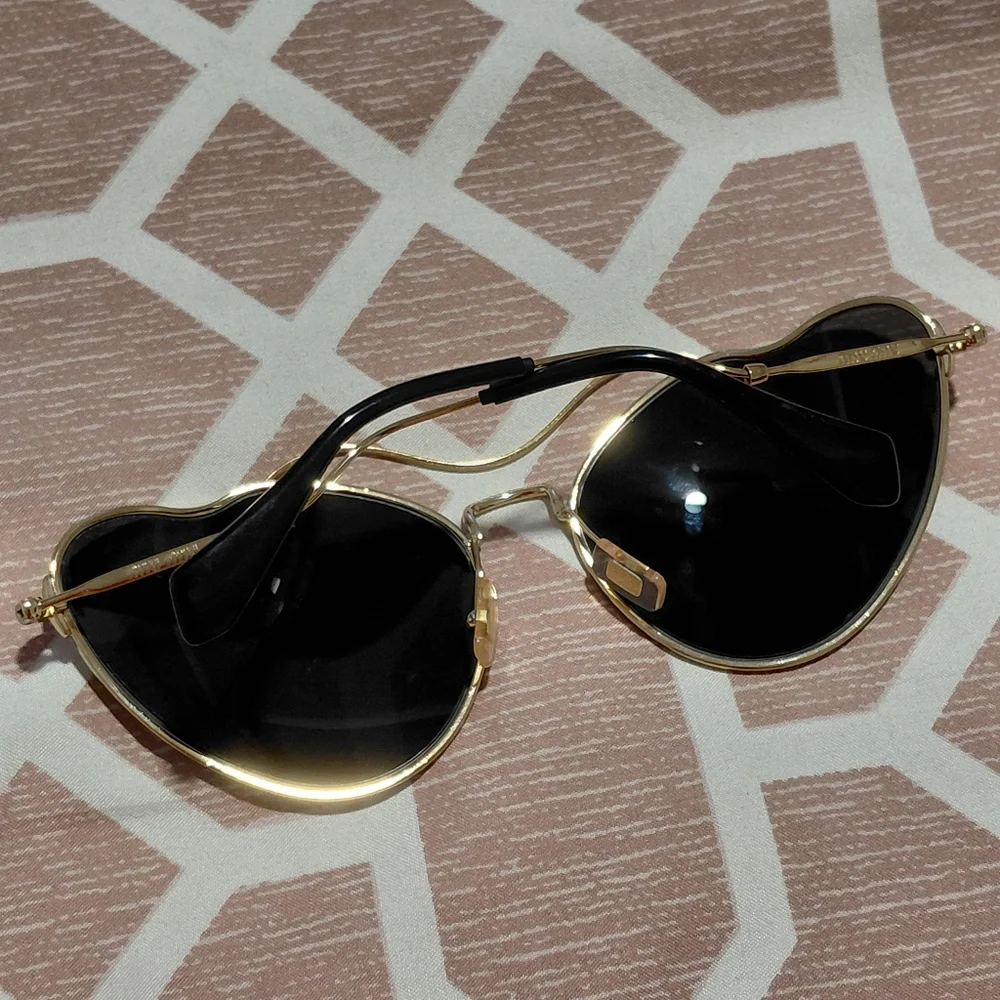 Miu Miu Gold Frame Sunglasses with Black Lenses